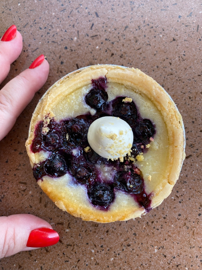 Order the Blueberry Buttermilk Pie at the Berry Patch booth at the Food and Wine Festival.