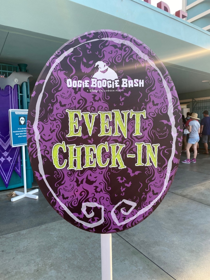 Event Check-In sign for the 2022 Oogie Boogie Bash at Disney California Adventure.
