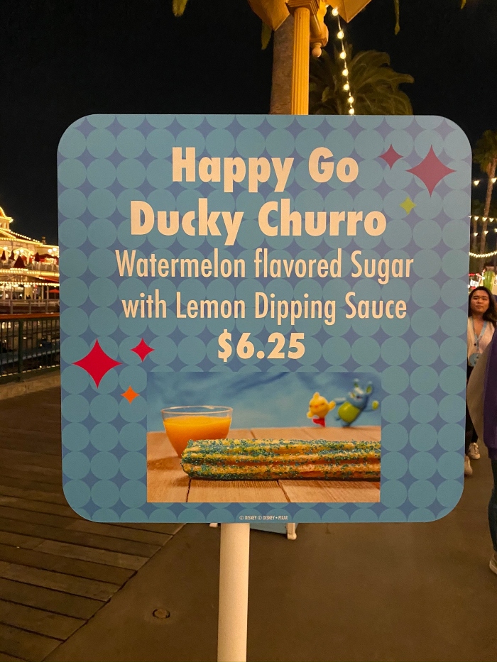 During a Disneyland After Dark event, you can order special food items that are only available for the event like a Happy Go Ducky Churro.