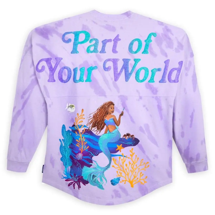 A brand new live action The Little Mermaid Spirit Jersey located at The Disneyland Resort. This purple tie-dye Spirit Jersey that features Ariel, Sebastian, and Flounder with the text that says Part of Your World.