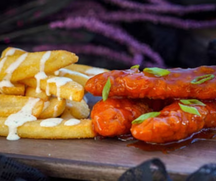 Spicy Chicken and Fries is a dish you can grab from Flo's V8 cafe!