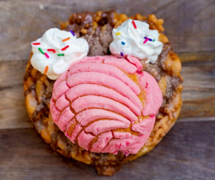 You order a Cinnamon-Chocolate Mexican Sweet Bread Funnel Cake from Stage Door Café in Disneyland! It is to celebrate Hispanic and Latin American Heritage Month!