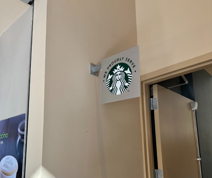 The Starbucks sign for their cafe at the Delta Hotels By Marriott.