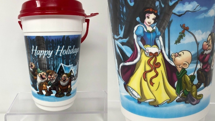 Snow White and the 7 Dwarfs are playing in a winter wonderland on this popcorn bucket that was sold at Disneyland in 2016.