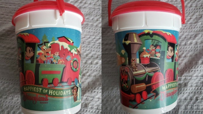 Mickey Mouse and his friends are taking a ride on the Disneyland train in this holiday popcorn bucket that was sold in 1992.