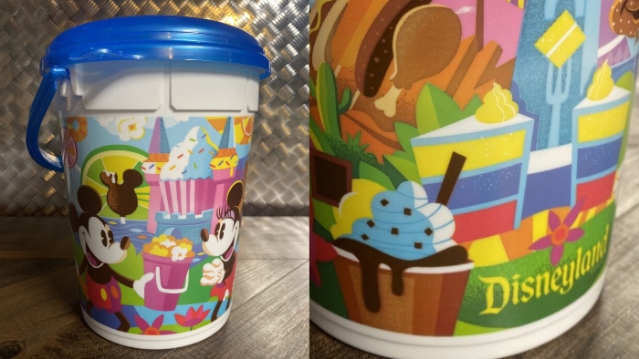In the 2019 Summer season, Disneyland sold a souvenir popcorn bucket that shows Mickey Mouse and Minnie Mouse enjoying different iconic Disney foods!